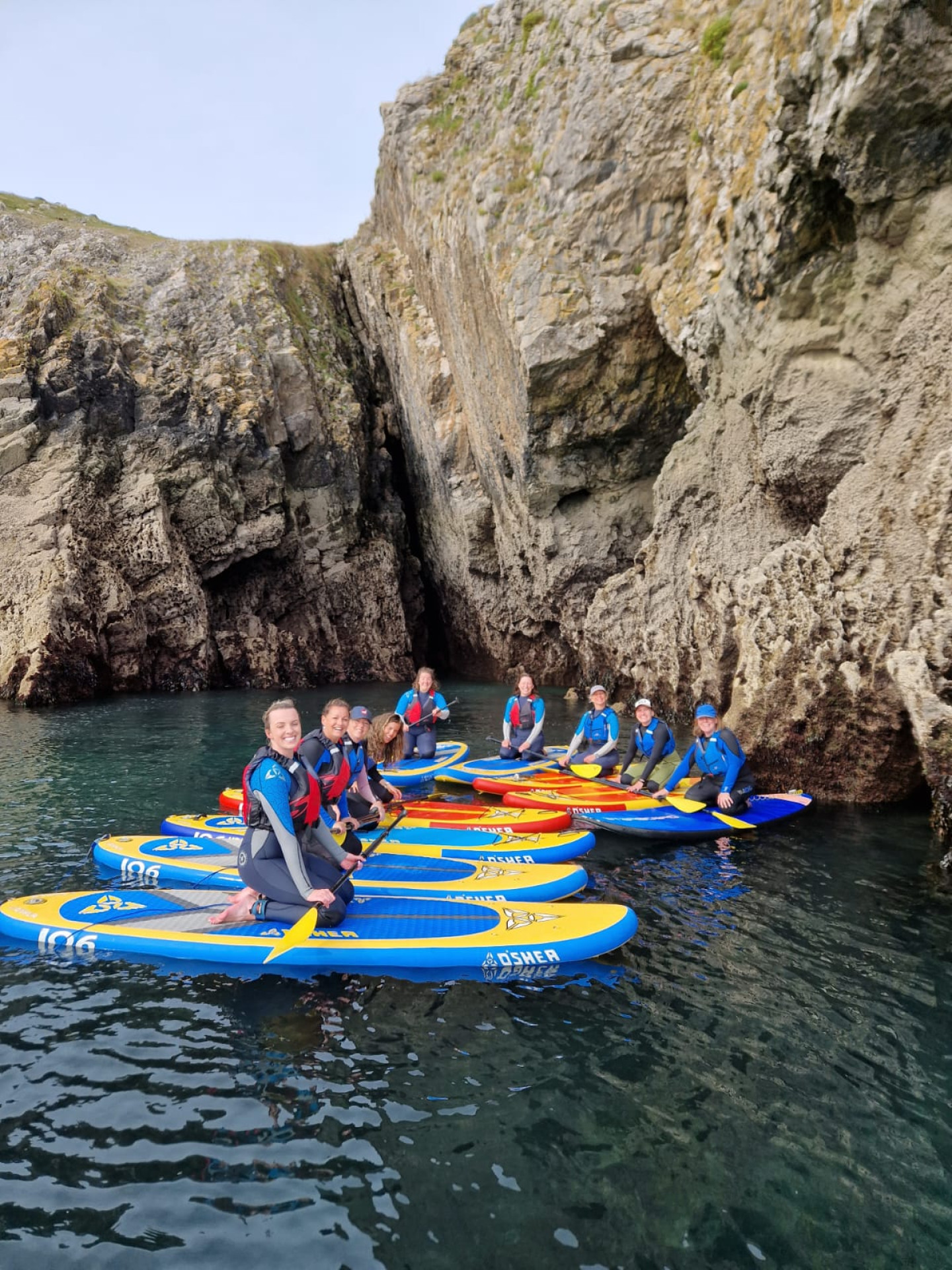 Women surfing in Pembrokeshire Wales