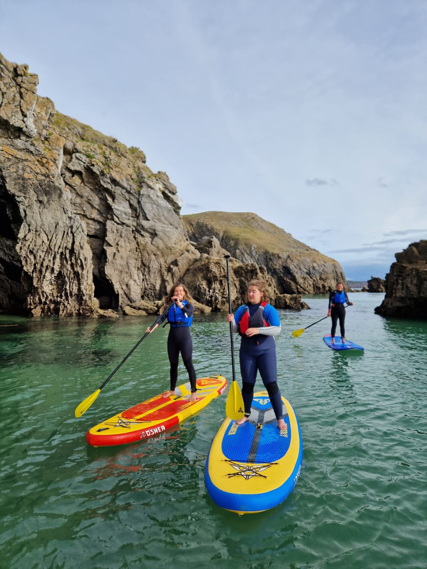 Women paddle boarding with Salty Sisters